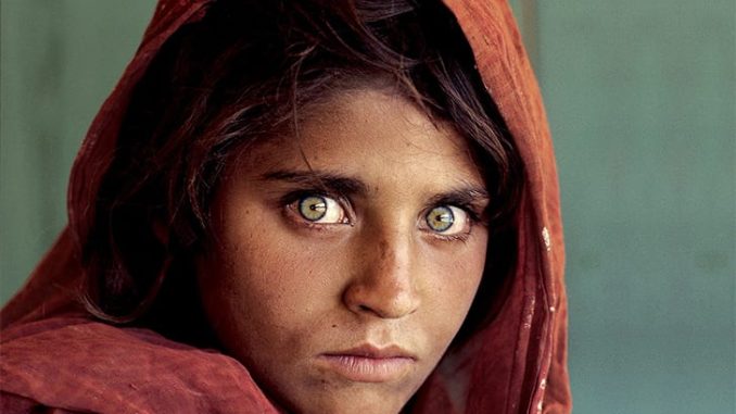 The Moving Tale Of The Woman Behind The World’s Most Iconic Photograph